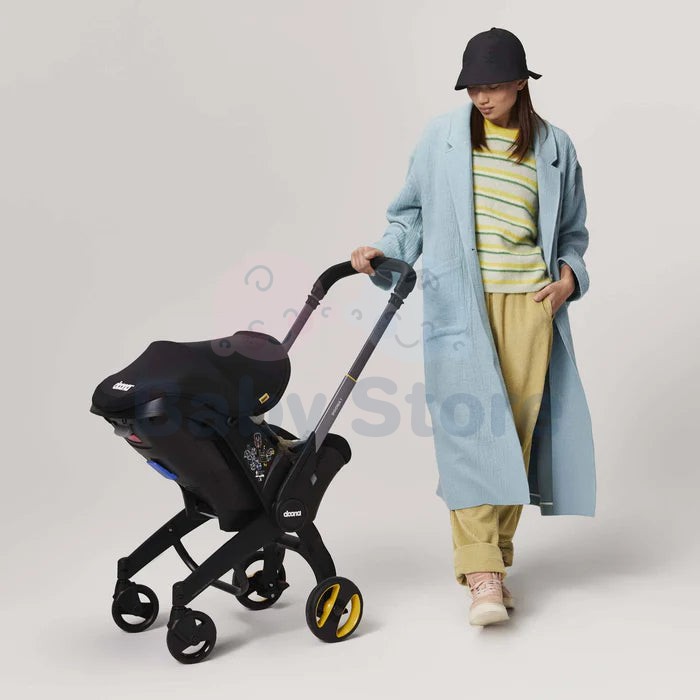 DOONA I i-Size Nitro Black automobilinė kėdutė–vežimėlis