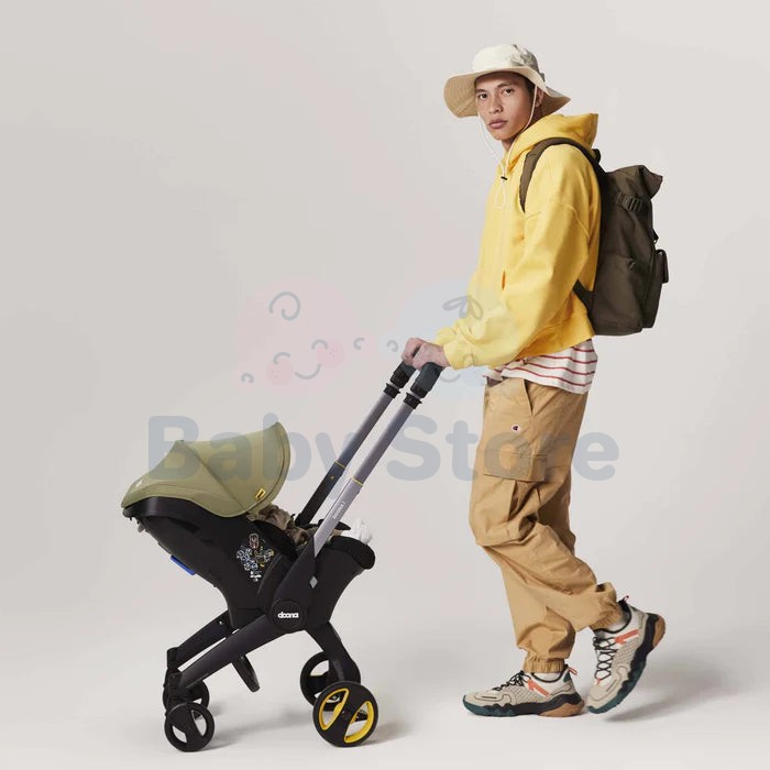 DOONA I i-Size Desert Green automobilinė kėdutė–vežimėlis